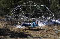 Walt lies in hammock in a steel tubing dome